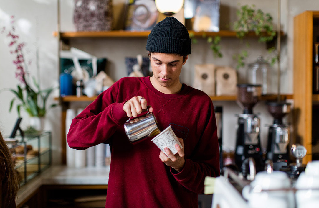 Sightglass Barista Pouring an Espresso Beverage.