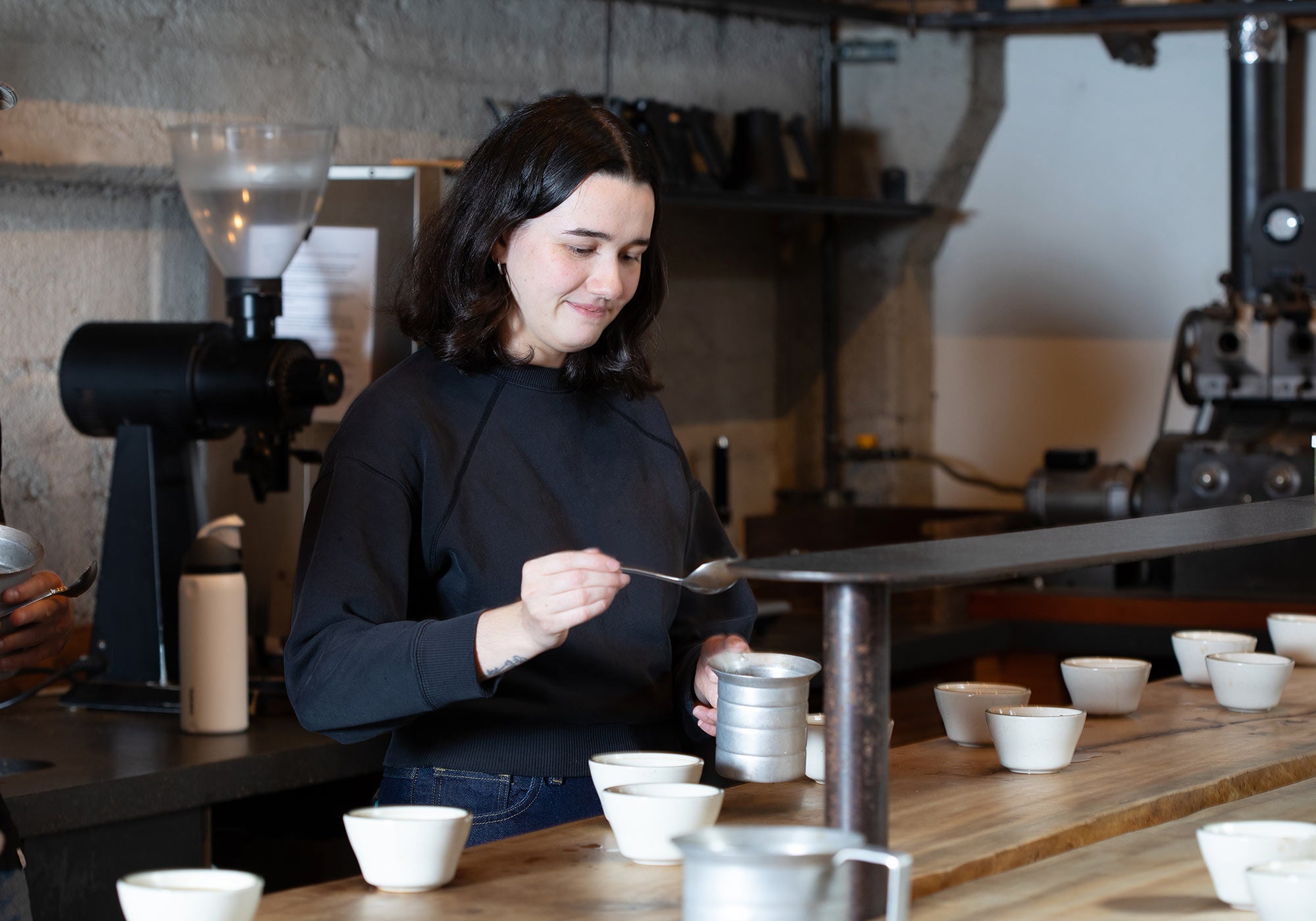 Sightglass Head of Education Megan Biolsi cupping coffee.